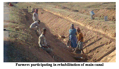 Text Box:    Farmers participating in rehabilitation of main canal  